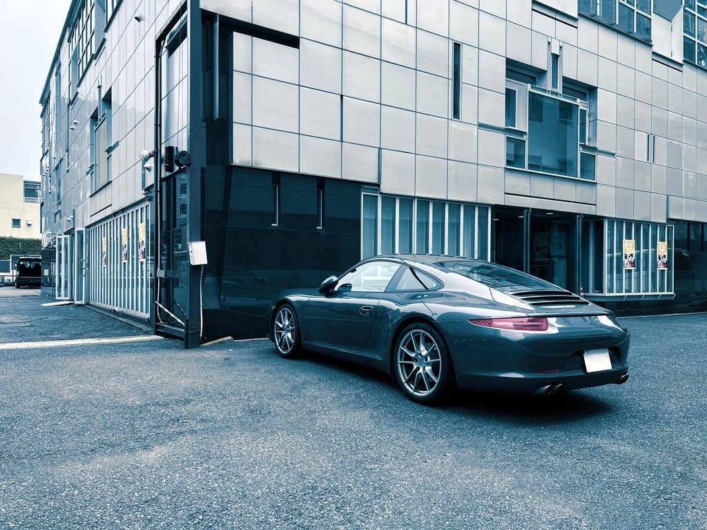 Grey sports car on a street in Tokyo